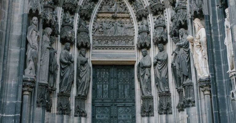 Cross-Cultural - Catholic cathedral door decorated with medieval statues