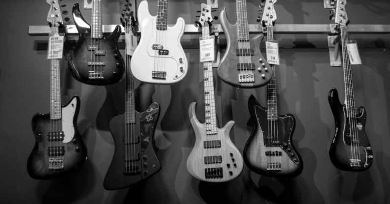 Acoustics - 8 Electric Guitars Hanged on Brown Steel Bar